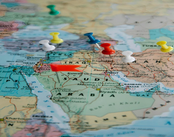Colorful pushpins marking locations on a world map